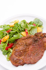 cervical chop with apricot-rocket salad