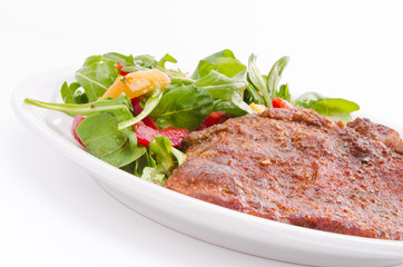 cervical chop with apricot-rocket salad