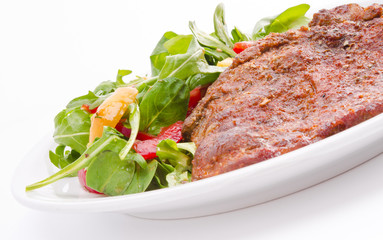 cervical chop with apricot-rocket salad