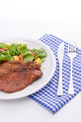 cervical chop with apricot-rocket salad