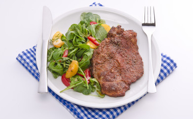cervical chop with apricot-rocket salad
