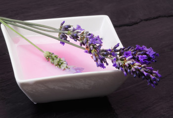 Obraz na płótnie Canvas lavender bath foam with flowers