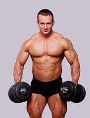 Fototapeta na wymiar Portrait of man posing in gym