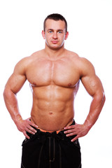 Fototapeta premium Portrait of strong man in gym
