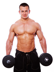 Fototapeta na wymiar Portrait of man in gym doing exercise