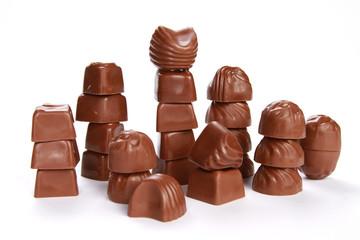 Broken chocolate tower isolated on white background