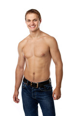 Fototapeta premium Cheerful young man in jeans with bare torso