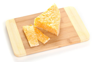 Cheese on cutting board isolated on white