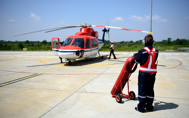 fireman is guarding for helicopter.