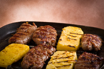 Sausage and sliced of polenta 