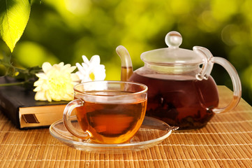 glass cup and teapot