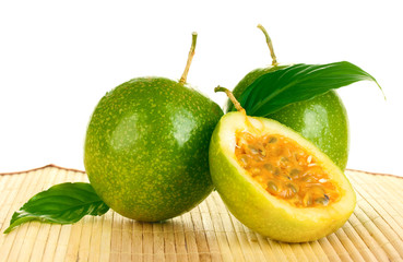 green passion fruit on white background close-up