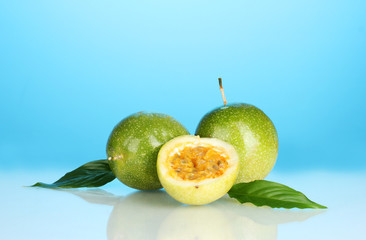 green passion fruit on blue background close-up