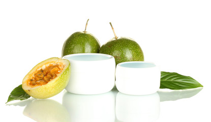 green passion fruit with cosmetic cream isolated