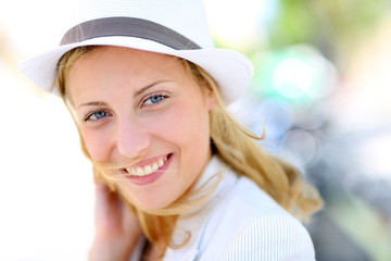 Closeup of beautiful young woman with hat