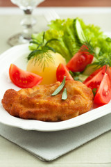 Wiener Schnitzel with potatoes and fresh vegetables