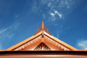 Thai style roof with blue sky