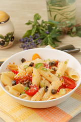 Penne pasta with cherry tomatoes and basil