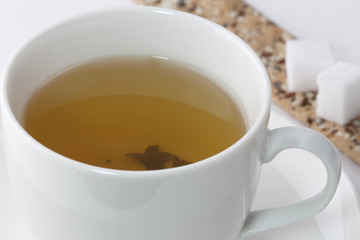 Tea cup and cookies with sugar
