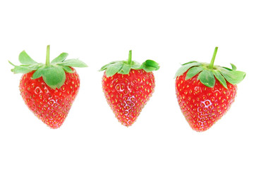 Three fresh strawberries closeup.