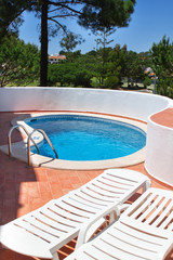 Pool in the tourist hotel in the area of the garden.