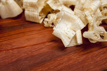 wooden shaving on pine wood background