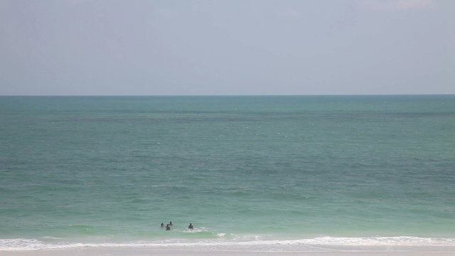 Lido beach, Florida. people swim in a clear day