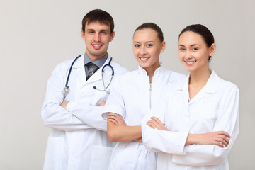 Three young doctor in white uniform