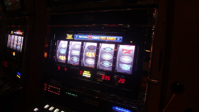 Someone playing slot machine in vegas