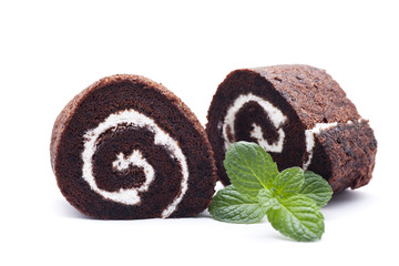 Chocolate cake with green mint leaves