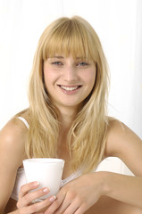 Young man holding a glass of milk