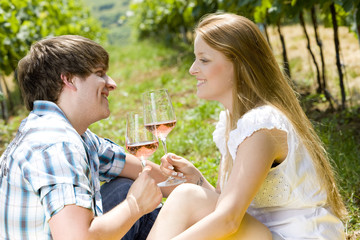 couple at a picnic in vineyard