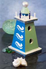 decorative lighthouse with seashell