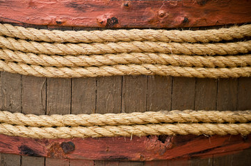 Old texture of wooden boards with vintage ship rope