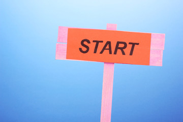 Start wooden board on blue background
