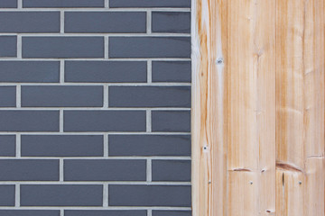 Wall from wood plank and gray brick