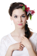 Fototapeta na wymiar Portrait of the beautiful girl with flowers in hair