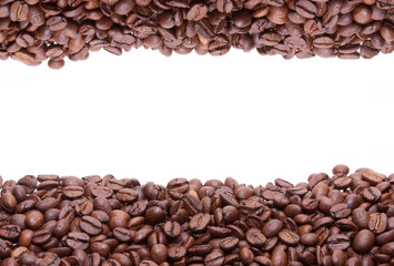 Two lines of roasted coffee beans