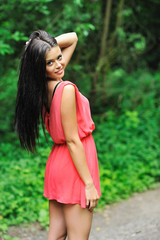 Fototapeta premium Pretty girl walking down the road
