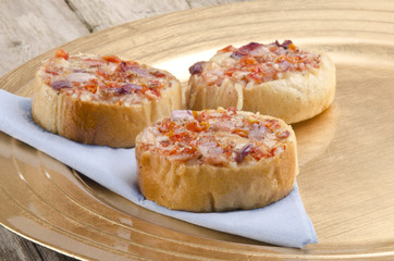 mini bruschetta on a paper napkin