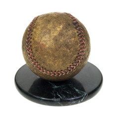 A well used baseball set on a granite base