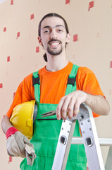 Fototapeta premium Repairman in coveralls in industrial concept