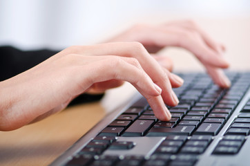 Hands typing on the keyboard