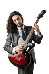 Obraz premium Guitar player in business suit on white