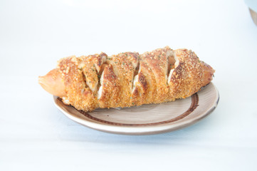 Hot dogs wrapped in crescent rolls with cheese and chicken in pl