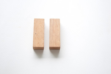 Two wooden letter on white background