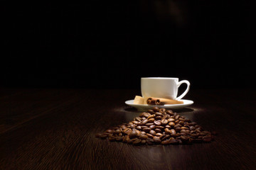 Coffee beans and white cup