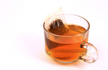 Cup of green tea isolated on white .