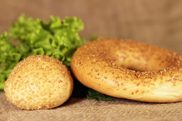 Delicious bun and bagel with lettuce