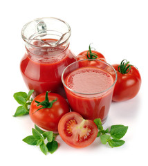 Jug, glass of tomato juice and fruit